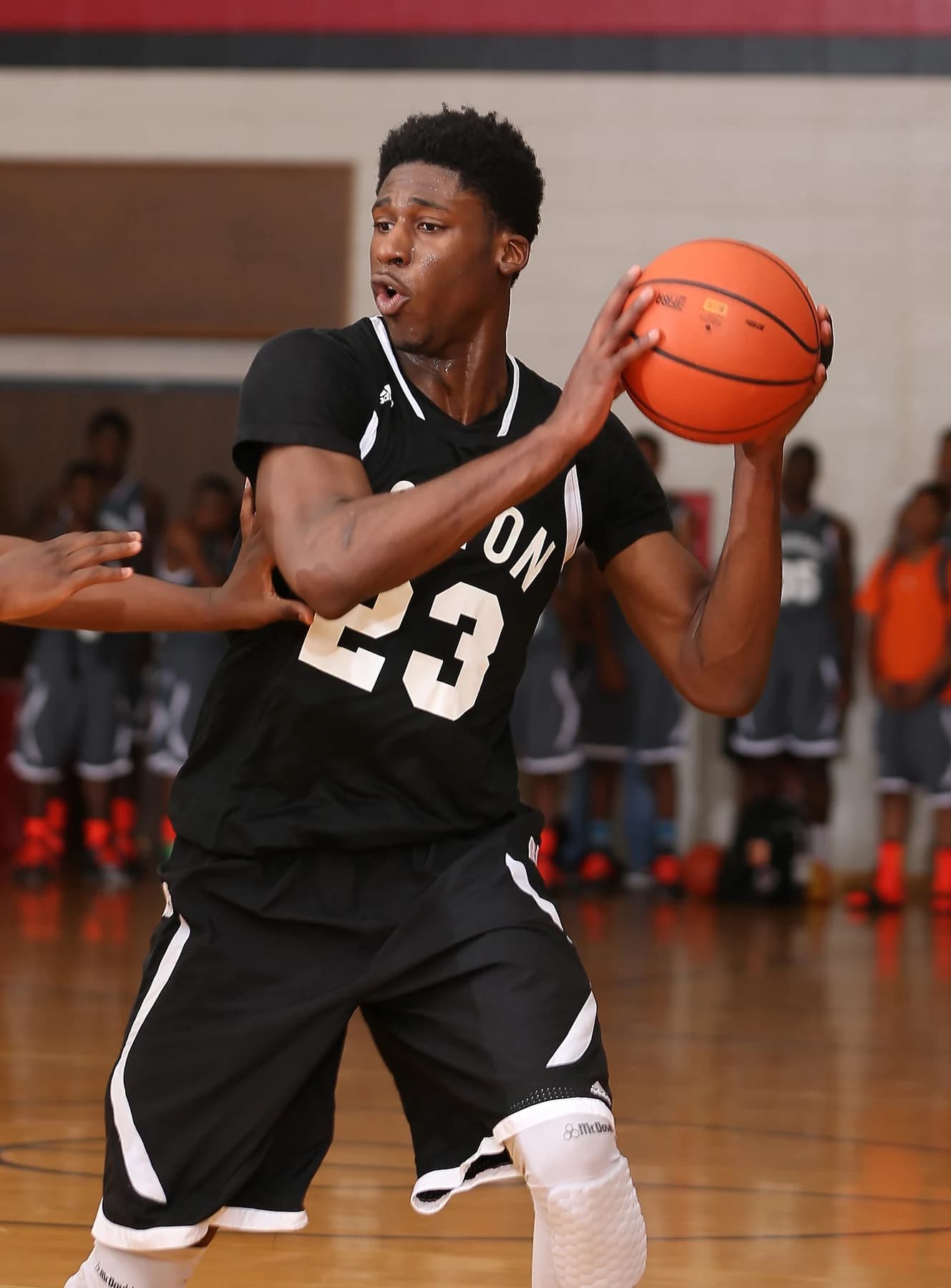 Basketball athlete holding the ball during a game
