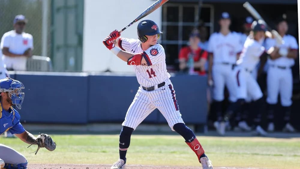 Baseball athlete batting during a game