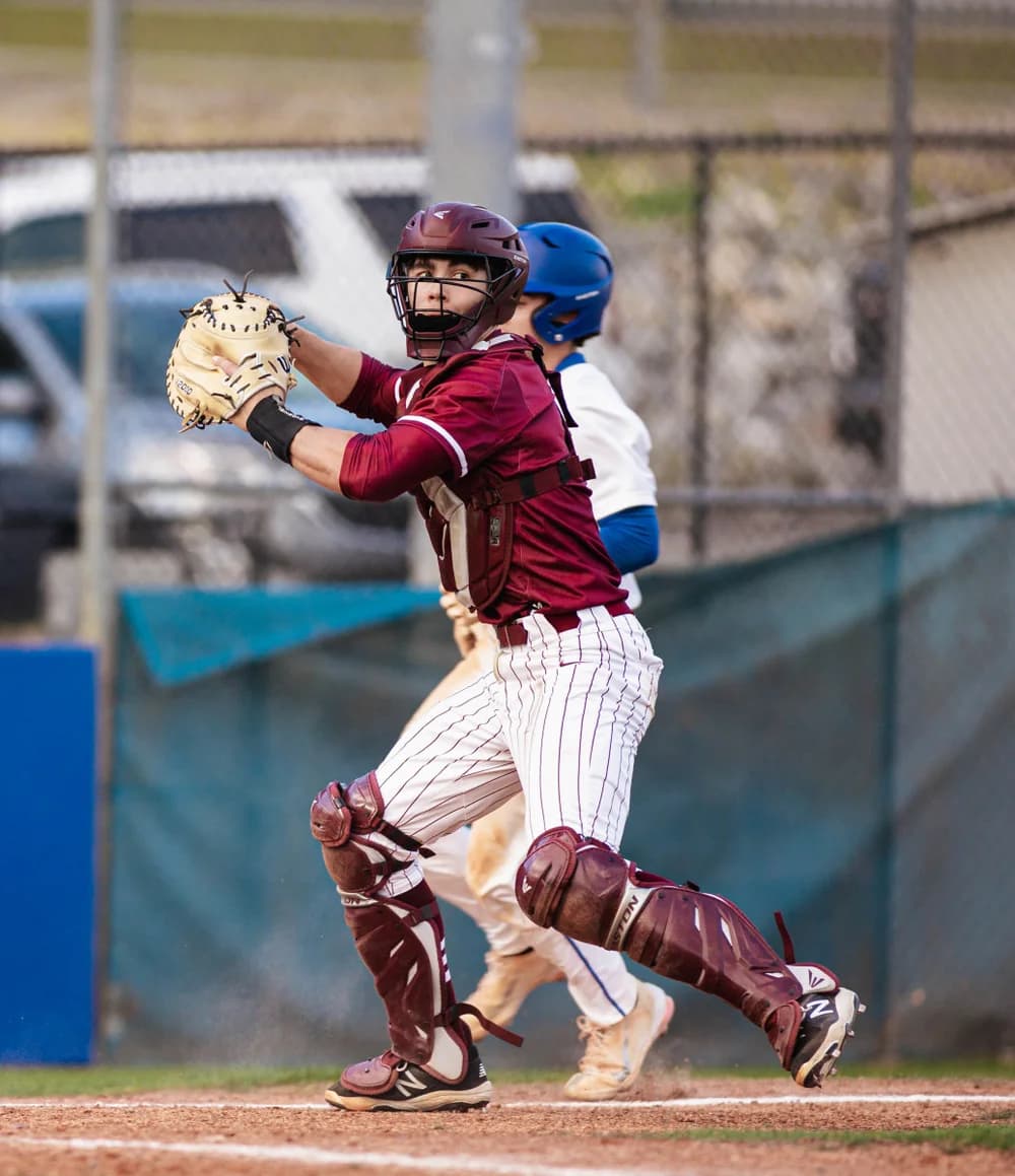 Baseball catcher preparing for a play