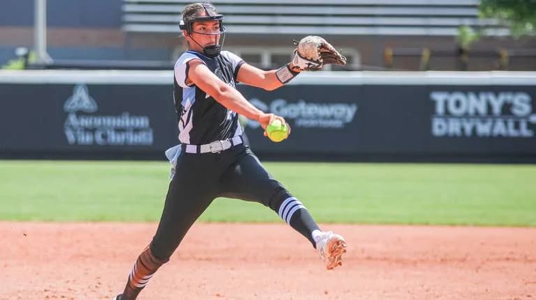 Softball pitcher delivering a pitch
