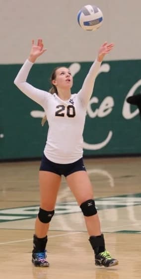 Volleyball athlete setting the ball
