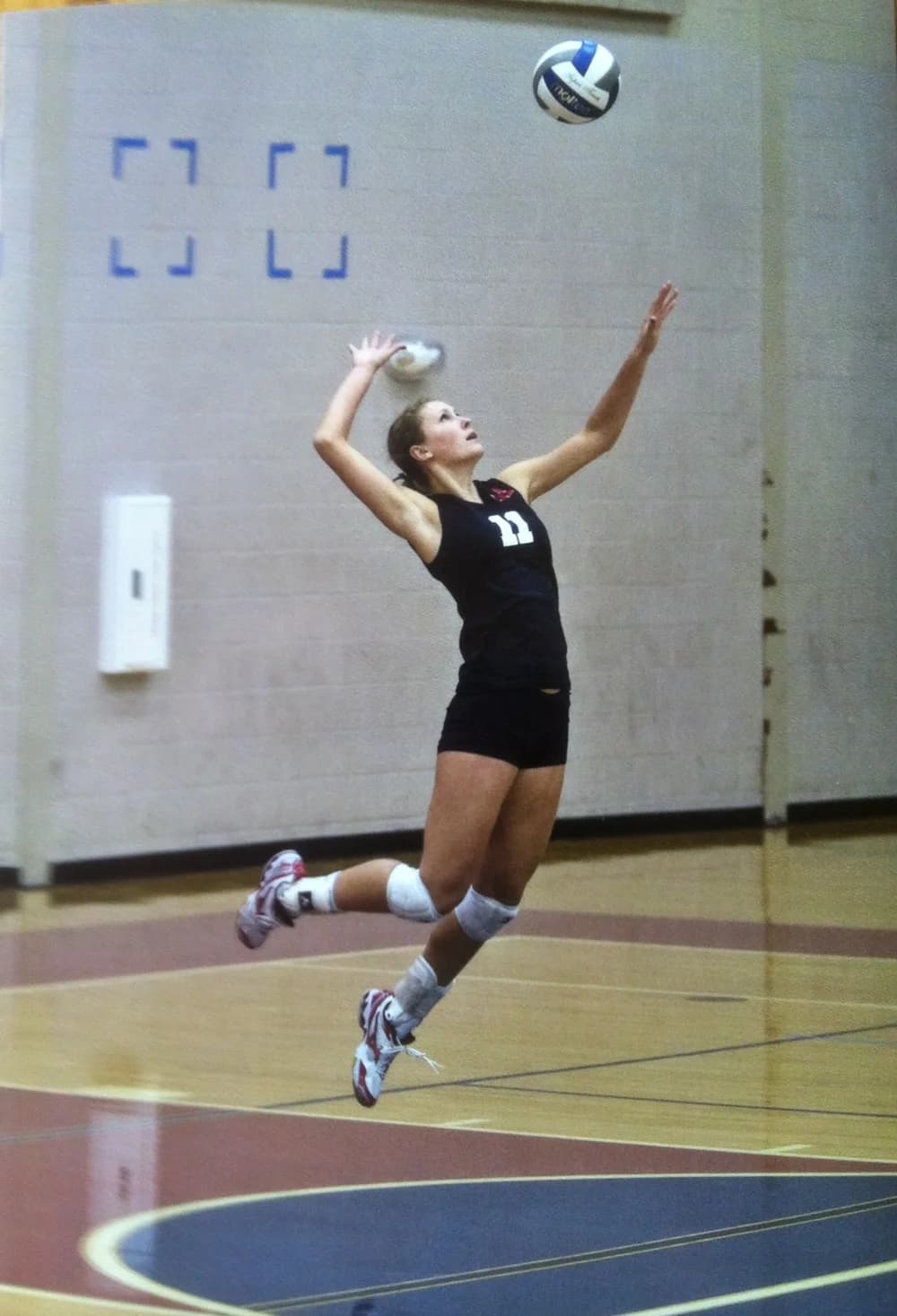 Volleyball athlete practicing a serve